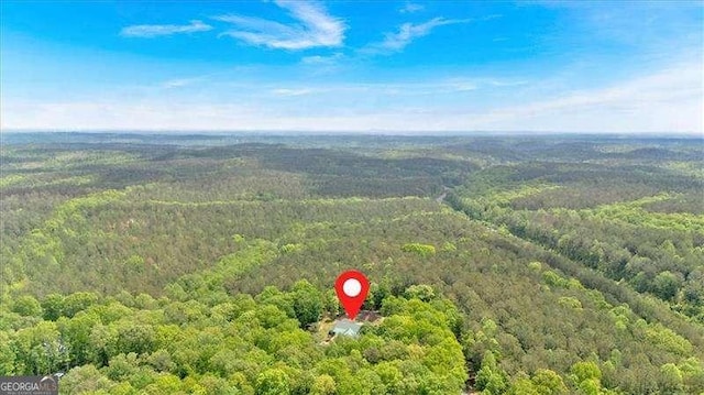 aerial view featuring a forest view