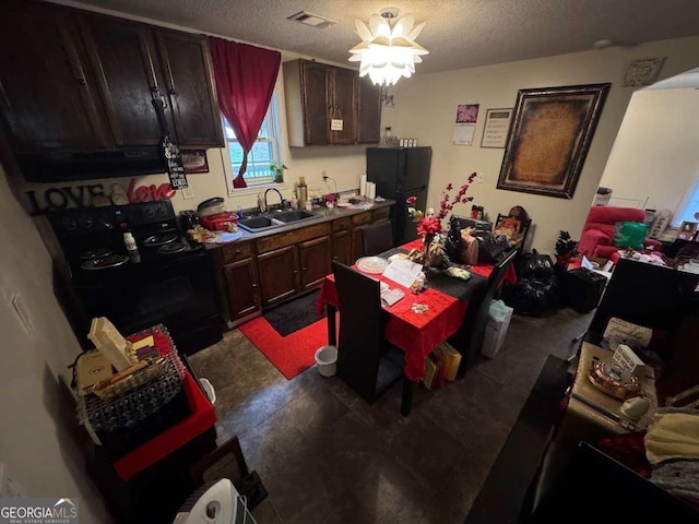 115 Sarsen Cir, Bogart, GA 30622 - kitchen featuring black appliances and a textured ceiling