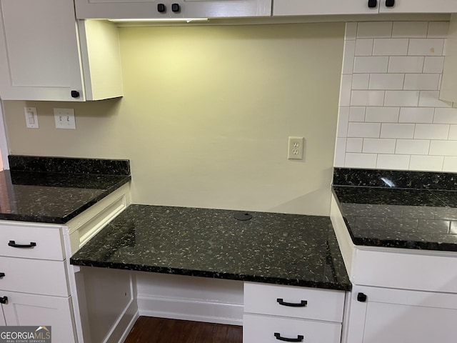 106 Zenith St, Dublin, GA 31021 - kitchen with dark wood-style floors, white cabinets, and dark stone countertops