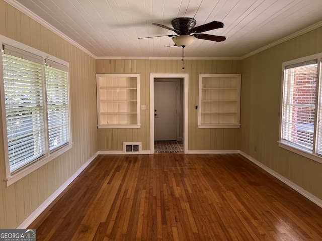 106 Zenith St, Dublin, GA 31021 - empty room with hardwood / wood-style floors, ornamental molding, built in shelves, ceiling fan, and visible vents