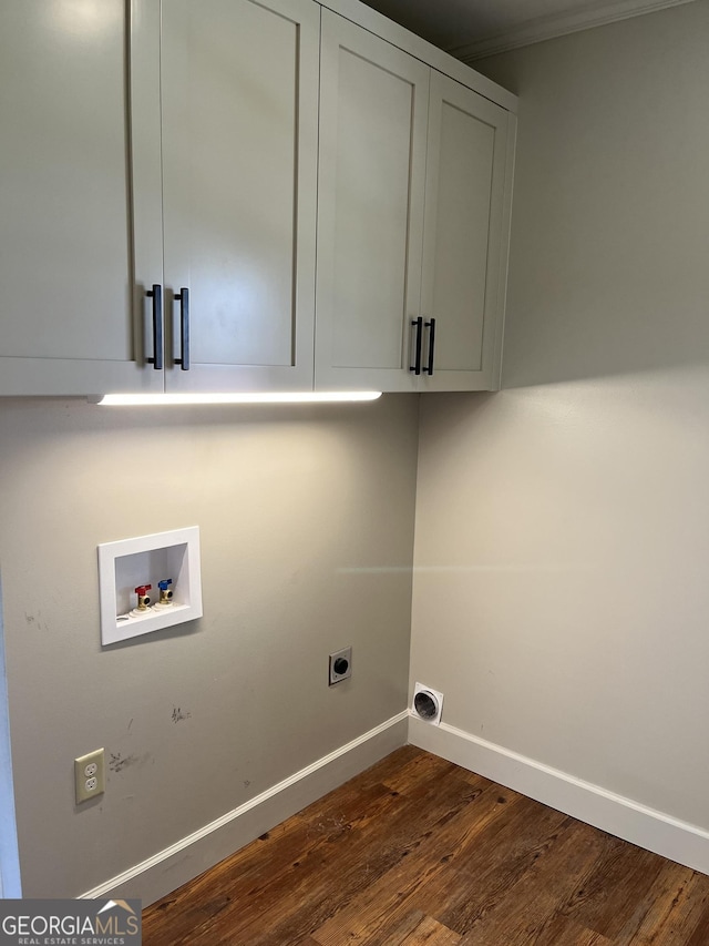 106 Zenith St, Dublin, GA 31021 - laundry room featuring baseboards, electric dryer hookup, cabinet space, washer hookup, and dark wood-style floors