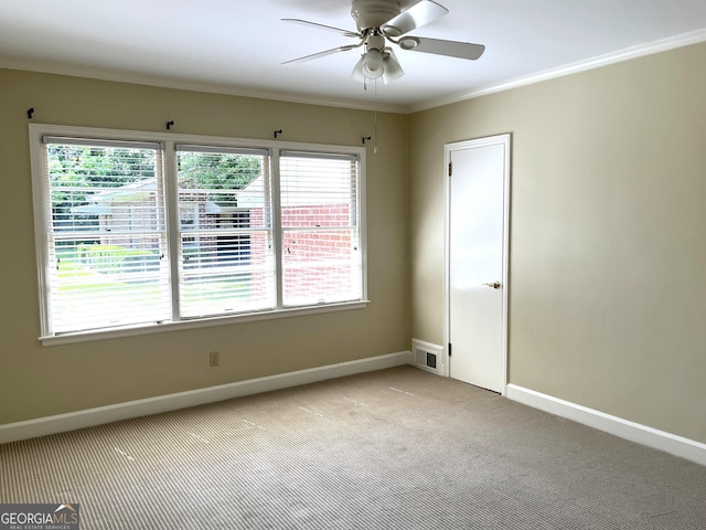 106 Zenith St, Dublin, GA 31021 - empty room with ornamental molding, light carpet, ceiling fan, baseboards, and visible vents