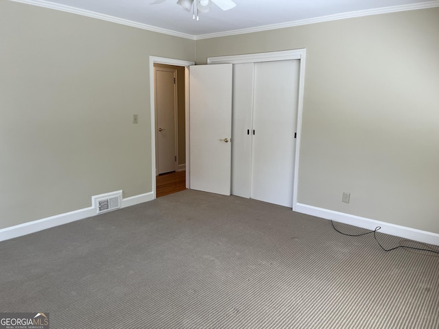 106 Zenith St, Dublin, GA 31021 - unfurnished bedroom featuring visible vents, ornamental molding, carpet floors, and a closet