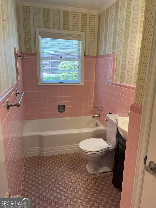 106 Zenith St, Dublin, GA 31021 - full bath featuring a bathtub, wallpapered walls, toilet, tile walls, and vanity