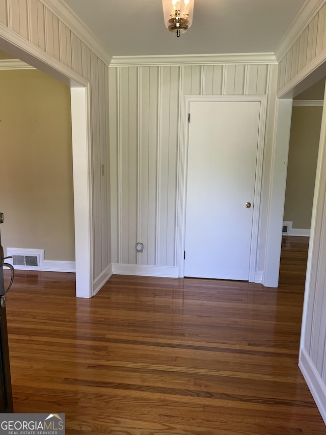 106 Zenith St, Dublin, GA 31021 - empty room featuring baseboards, visible vents, wood finished floors, and crown molding