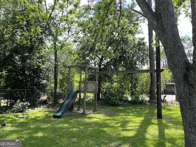 106 Zenith St, Dublin, GA 31021 - view of playground featuring a yard and fence