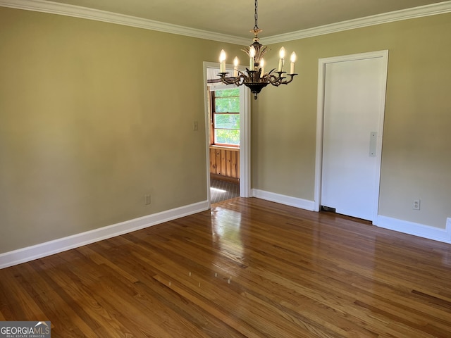 106 Zenith St, Dublin, GA 31021 - empty room featuring an inviting chandelier, wood finished floors, crown molding, and baseboards