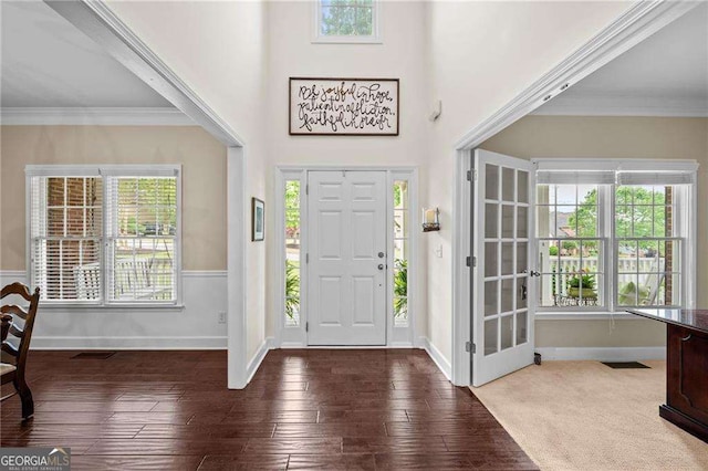 9310 Old Preserve Trl, Ball Ground, GA 30107 - entrance foyer featuring baseboards, ornamental molding, visible vents, and hardwood / wood-style flooring