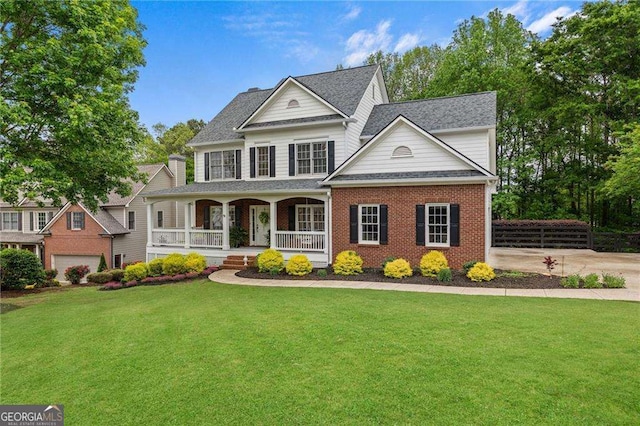 9310 Old Preserve Trl, Ball Ground, GA 30107 - view of front facade featuring a porch, a front lawn, brick siding, and roof with shingles