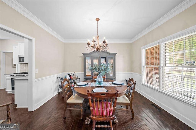 9310 Old Preserve Trl, Ball Ground, GA 30107 - dining space featuring a wainscoted wall, visible vents, dark wood-style floors, and a chandelier