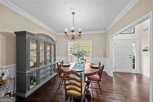 9310 Old Preserve Trl, Ball Ground, GA 30107 - dining space featuring a chandelier, wainscoting, dark wood-type flooring, and ornamental molding