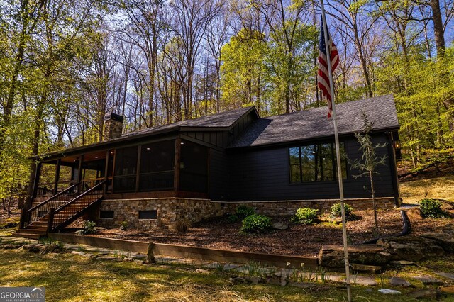 480 Riveredge Ln # 9063, Ellijay, GA 30540 - back of house with stairway, a chimney, roof with shingles, and a sunroom