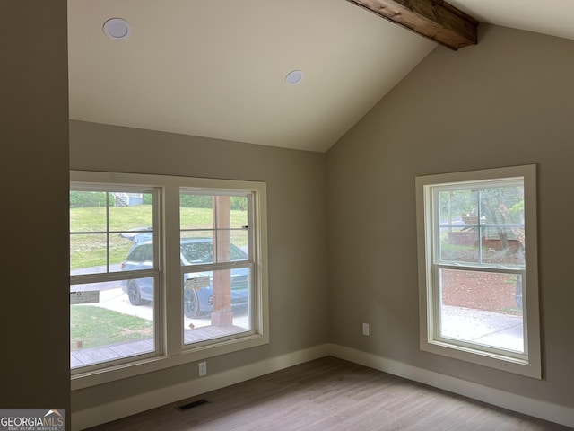 135 Church St, Palmetto, GA 30268 - unfurnished room with lofted ceiling with beams, light wood-style flooring, visible vents, and a wealth of natural light
