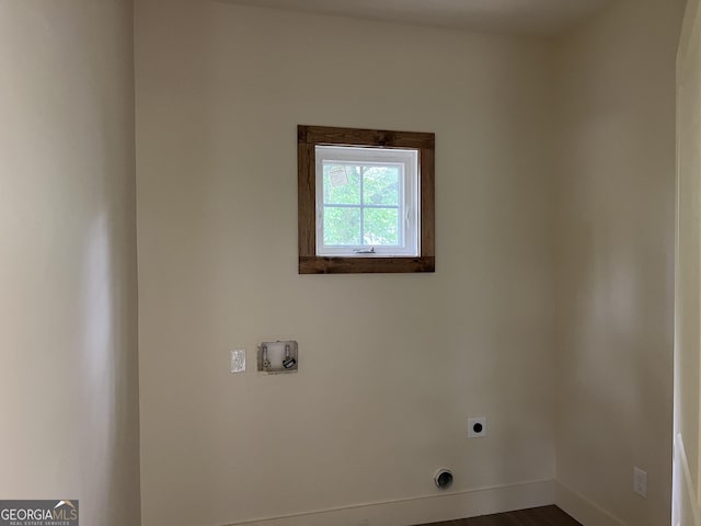 135 Church St, Palmetto, GA 30268 - laundry room with hookup for an electric dryer, baseboards, hookup for a washing machine, dark wood finished floors, and laundry area