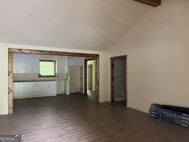 135 Church St, Palmetto, GA 30268 - unfurnished living room with dark wood finished floors and wood walls