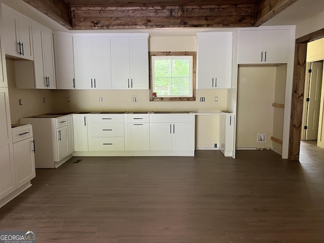 135 Church St, Palmetto, GA 30268 - kitchen featuring dark wood-style floors and white cabinetry