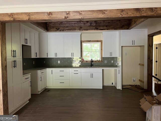 135 Church St, Palmetto, GA 30268 - kitchen with a sink, dark wood-type flooring, decorative backsplash, and white cabinetry