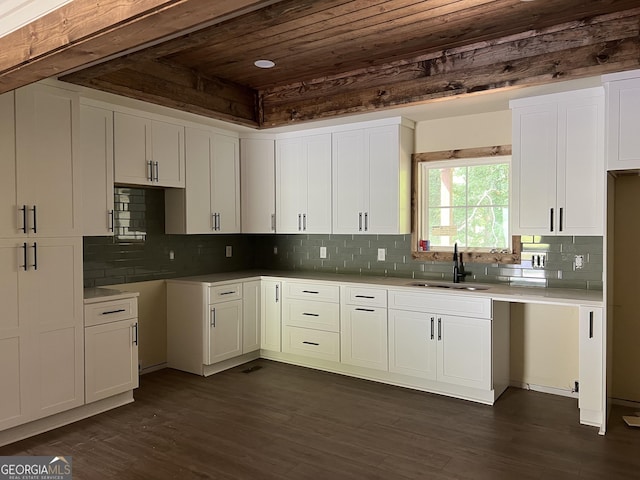 135 Church St, Palmetto, GA 30268 - kitchen featuring a sink, wooden ceiling, white cabinetry, and paneled refrigerator