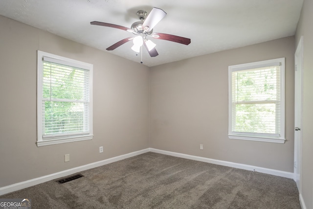 2041 W Flat Shoals Ter, Decatur, GA 30034 - carpeted empty room featuring visible vents, ceiling fan, plenty of natural light, and baseboards