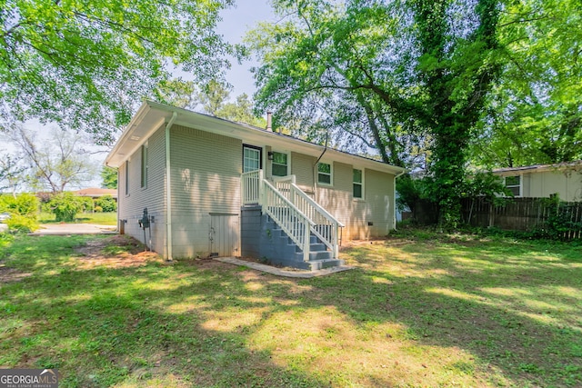 2041 W Flat Shoals Ter, Decatur, GA 30034 - rear view of house with fence and a yard