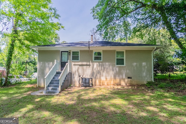 2041 W Flat Shoals Ter, Decatur, GA 30034 - back of house with a lawn, brick siding, central AC unit, and crawl space