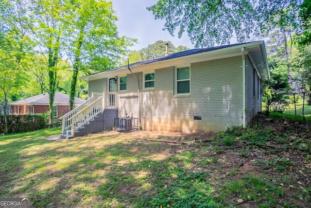 2041 W Flat Shoals Ter, Decatur, GA 30034 - back of house with cooling unit, fence, a yard, and brick siding