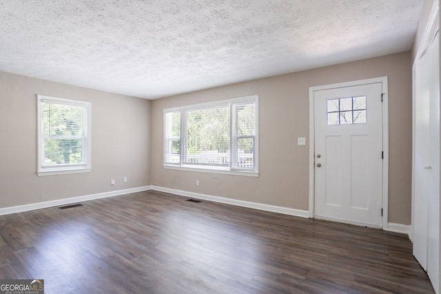 2041 W Flat Shoals Ter, Decatur, GA 30034 - foyer with dark wood-type flooring, visible vents, and a wealth of natural light