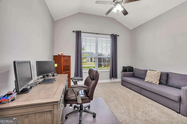 office area with lofted ceiling, ceiling fan, baseboards, and light carpet
