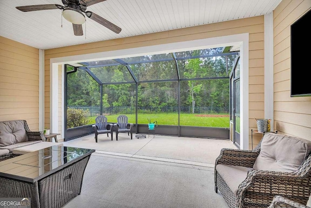 sunroom / solarium with ceiling fan