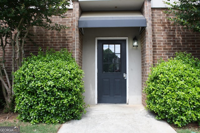 3301 Henderson Mill Rd Unit D3, Atlanta, GA 30341 - doorway to property with brick siding and stucco siding