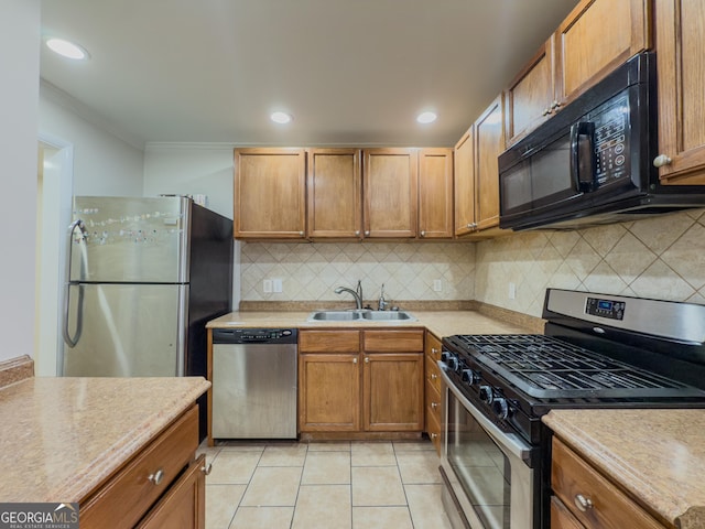 3301 Henderson Mill Rd Unit D3, Atlanta, GA 30341 - kitchen featuring light countertops, stainless steel appliances, light tile patterned floors, and a sink