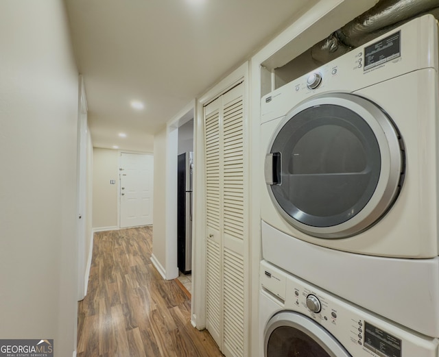 3301 Henderson Mill Rd Unit D3, Atlanta, GA 30341 - laundry area with laundry area, stacked washer / drying machine, wood finished floors, baseboards, and recessed lighting