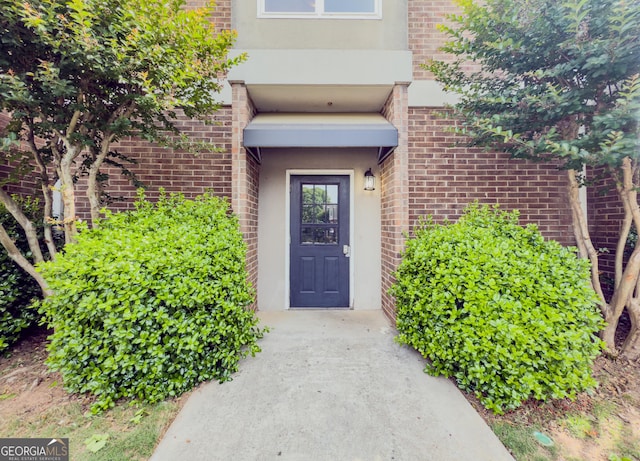 3301 Henderson Mill Rd Unit D3, Atlanta, GA 30341 - view of exterior entry featuring stucco siding and brick siding