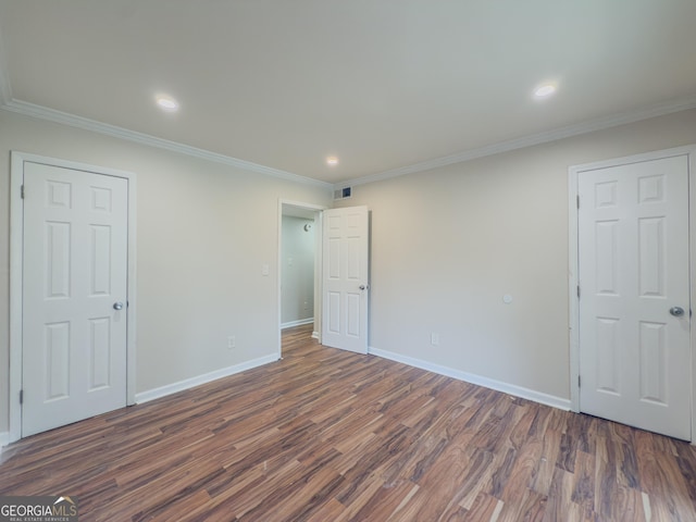 3301 Henderson Mill Rd Unit D3, Atlanta, GA 30341 - unfurnished bedroom with baseboards, dark wood-style floors, and ornamental molding