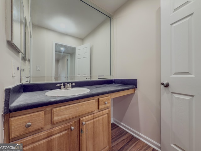 3301 Henderson Mill Rd Unit D3, Atlanta, GA 30341 - bathroom featuring vanity, baseboards, and wood finished floors
