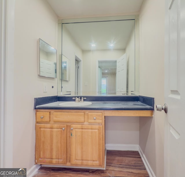 3301 Henderson Mill Rd Unit D3, Atlanta, GA 30341 - bathroom featuring vanity, baseboards, and wood finished floors