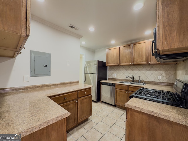 3301 Henderson Mill Rd Unit D3, Atlanta, GA 30341 - kitchen with electric panel, backsplash, a sink, ornamental molding, and stainless steel appliances