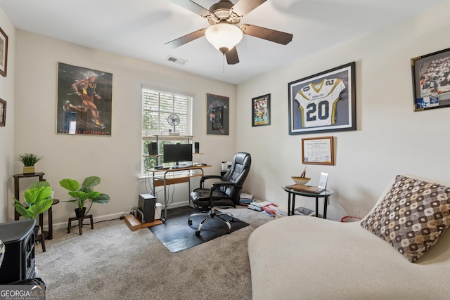 office space featuring baseboards, visible vents, ceiling fan, and carpet
