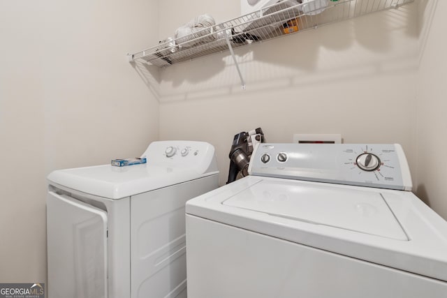 laundry room featuring washer and clothes dryer and laundry area