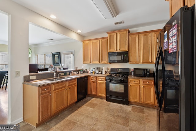 kitchen featuring recessed lighting, a sink, crown molding, black appliances, and visible vents