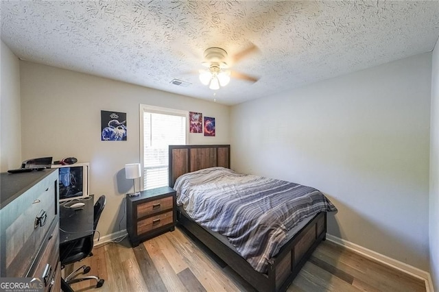2889 Estuary Dr, Acworth, GA 30101 - bedroom with visible vents, light wood-style flooring, baseboards, and ceiling fan