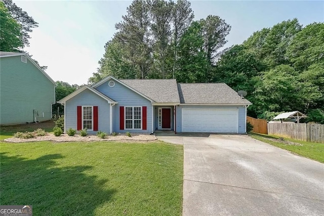 2889 Estuary Dr, Acworth, GA 30101 - ranch-style house featuring concrete driveway, an attached garage, fence, and a front yard