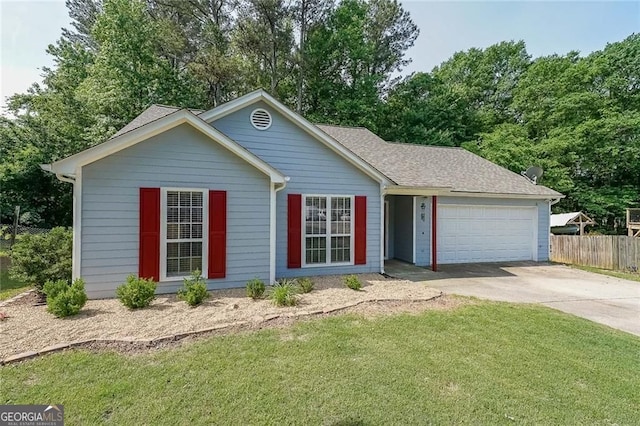 2889 Estuary Dr, Acworth, GA 30101 - ranch-style home with roof with shingles, fence, an attached garage, concrete driveway, and a front yard
