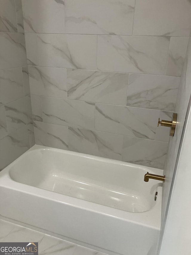 full bathroom with a washtub