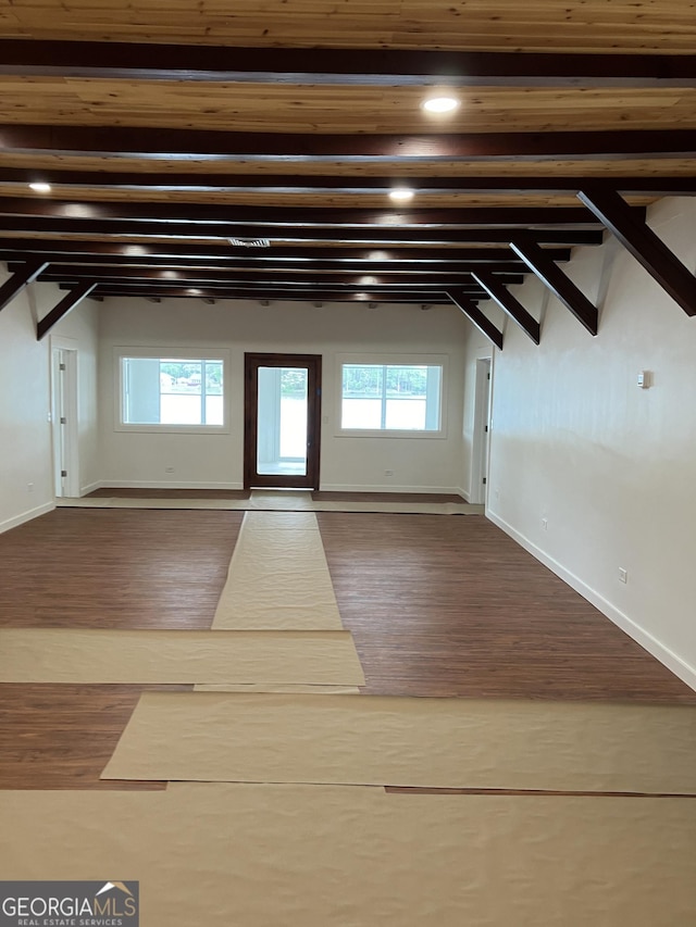 bonus room featuring baseboards, recessed lighting, wood finished floors, and a healthy amount of sunlight