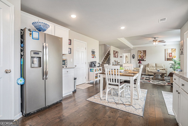 3399 In Bloom Way, Auburn, GA 30011 - dining area featuring stairs, dark wood finished floors, a ceiling fan, recessed lighting, and a tray ceiling