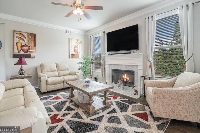 3399 In Bloom Way, Auburn, GA 30011 - living area featuring wood finished floors, ornamental molding, ceiling fan, a fireplace, and plenty of natural light