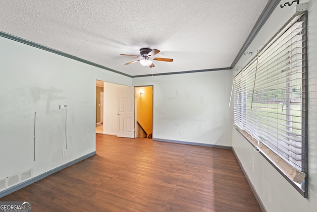 2823 Connally Dr SW, Atlanta, GA 30311 - unfurnished room with a textured ceiling, wood finished floors, a ceiling fan, ornamental molding, and baseboards