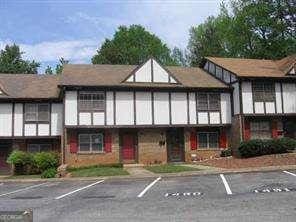 view of building exterior with uncovered parking