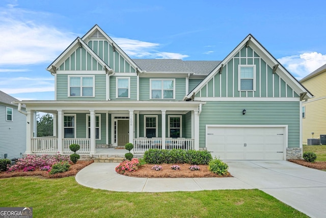 1606 Chancery Ln, Lithia Springs, GA 30122 - craftsman house with board and batten siding, a porch, an attached garage, and central AC